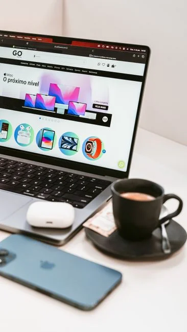 A tablet with a financial website open, alongside a white keyboard and mouse. Ideal for tech-theme stock images.